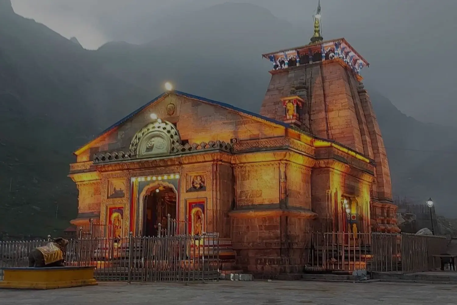 Kedarnath temple lit up at dusk, Uttarakhand